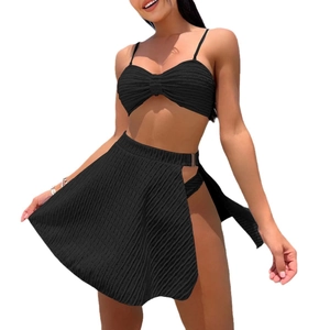 Three-piece black bikini set with textured knit top, bottom, and side-slit mesh skirt