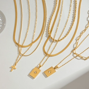 Gold layered stainless steel necklace with star pendant and square tag charms set