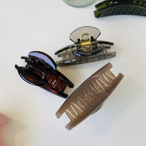 Elegant French-style shark hair clips in assorted colors like tortoise and dark green