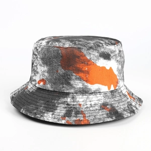Detailed close-up of marble tie-dye bucket hat with vibrant orange ink splatters and stitching
