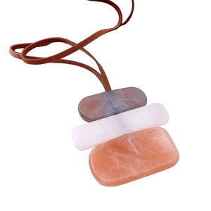 Bohemian long necklace with stacked geometric acrylic pendants and brown faux suede cord