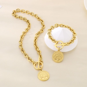 Detailed view of gold tree of life pendant necklace and bracelet set with OT buckle closure
