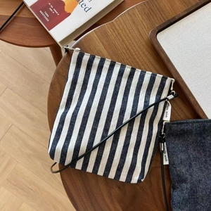 Vintage blue and white striped canvas crossbody phone bag with slim leather shoulder strap