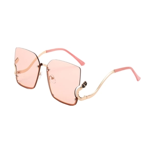 Fashion oversized rimless sunglasses with pink lenses and gold leopard metal temples