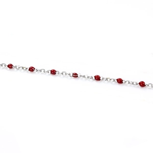 Detail of silver stainless steel chain with round red enamel beads for DIY jewelry making