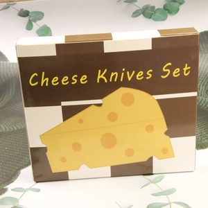 Detail of Cheese Knives Set packaging with brown checkered pattern and cheese illustration