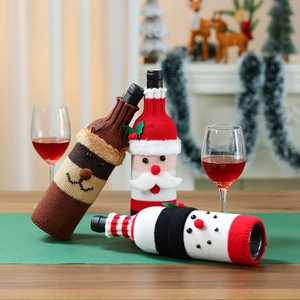 Christmas knitted wine bottle covers with Santa Reindeer and Snowman festive designs