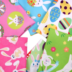 Detailed fabric texture of Easter pet bandanas with rabbit, egg and floral print patterns