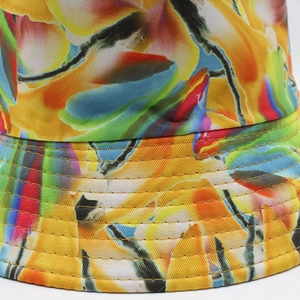 Close-up of vibrant floral print bucket hat with reinforced multi-row brim stitching