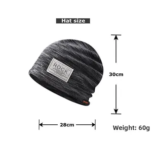 Detail view of dark grey knit beanie featuring Rock patch and Sport label with size dimensions