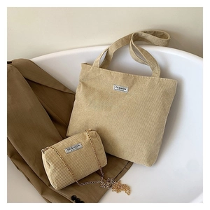 Detail of khaki corduroy tote bag set with matching small chain crossbody purse