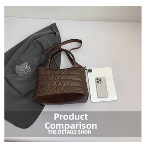 Detail view of brown quilted nylon shoulder bag with detachable strap and laptop scale