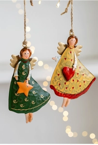 Detail of vintage iron Christmas angel ornaments with hand-painted metal finish