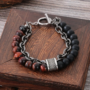 Detail of men's double-layer bracelet with red tiger eye beads and black matte stones