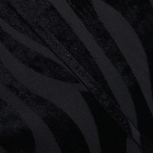 Macro view of black flocked velvet fabric texture and twill base detail on a tube top