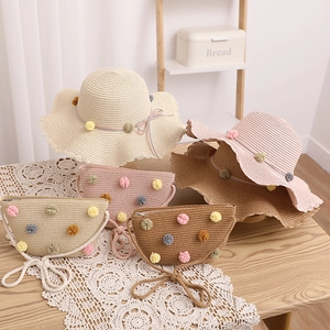 Kids straw hat and bag set with colorful pom-poms in white, pink, and khaki colors