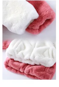 Detail of soft plush cuffs and hem on pink faux rabbit fur coat for kids