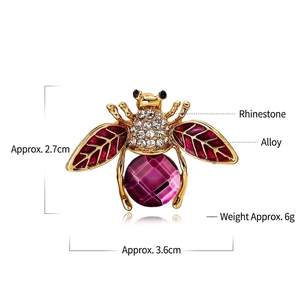 Detail of bee brooch with purple gemstone and white crystals, 3.6cm by 2.7cm size