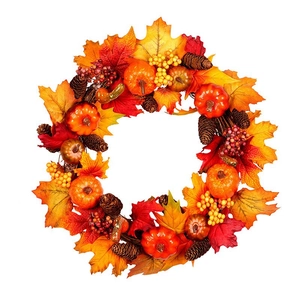 Artificial Thanksgiving wreath with maple leaves, pumpkins and pinecones on white background
