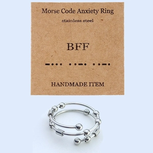 Detail of Morse Code fidget ring for anxiety relief with movable beads on a BFF card