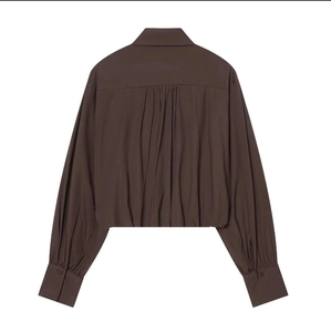 Rear view of brown long sleeve cropped shirt featuring a gathered pleated back design