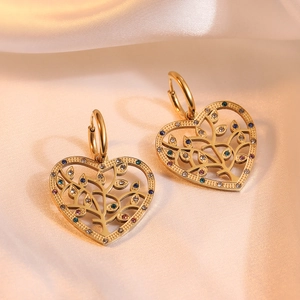 Gold tree of life heart earrings with colorful zircons on soft silk background