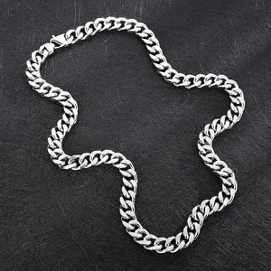 Macro detail of 14mm silver polished titanium steel cuban link chain for men