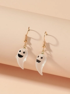 Detailed close-up of cute white resin ghost earrings with gold hooks for Halloween
