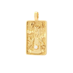 Macro detail of gold plated tarot tower pendant with inlaid sparkling white zircon