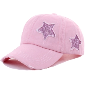 Pink distressed cotton baseball cap with purple glitter star patches in a 45-degree side view
