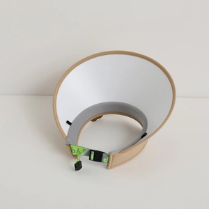Detail of adjustable green drawstring and internal sweatband on khaki sun visor hat