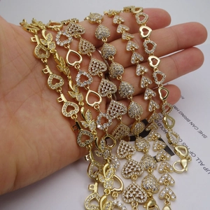 Adjustable gold heart and key charm bracelet with micro-pave cubic zirconia crystals