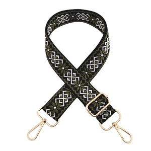 Detail of bohemian geometric pattern woven strap with gold metal lobster clasps