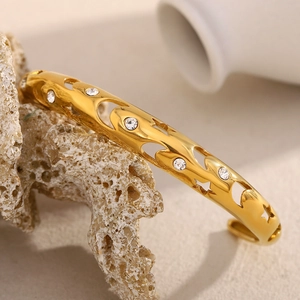 Elegant 18K gold plated stainless steel hollow star-moon bangle with sparkling zircons