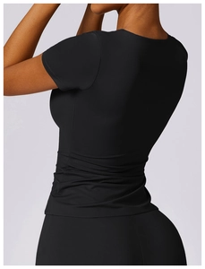 Side view of black slim fit sports t-shirt with side ruching and breathable fabric