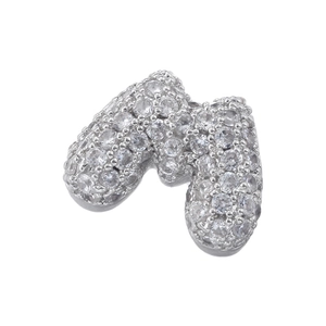 Macro shot of silver letter M charm pendant with paved 5A cubic zirconia stones