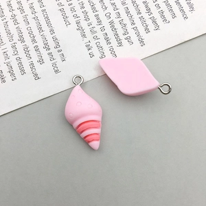 Detail of pink resin flower bear pendants with metal rings for DIY handmade accessories