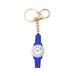 Detail of blue watch-shaped acrylic keychain with golden metal ring and clasp
