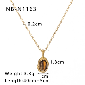 Detail showing dimensions of tiger eye pendant on a gold stainless steel chain necklace