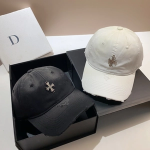 Black and white distressed baseball caps with metal cross in premium gift packaging