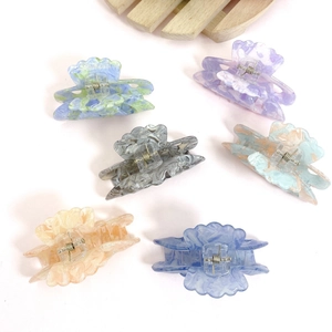 French retro acrylic hair claws with marble texture in various pastel mermaid colors