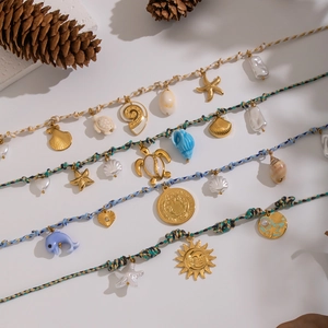 Handmade Bohemian woven cord necklaces with colorful sea shells and marine animal charms
