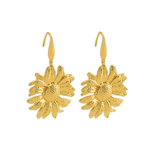 Detail of sunflower drop earrings with hammered gold finish and textured center