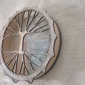 Detailed view of handmade Independence Day wooden drum ornament with vintage blue patterns
