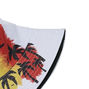 Close-up of tropical palm tree and sunset print on a white canvas bucket hat brim