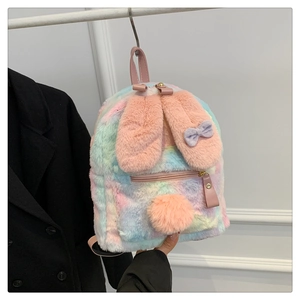 Detail of macaron tie-dye plush bunny backpack with soft pink ears and ribbon