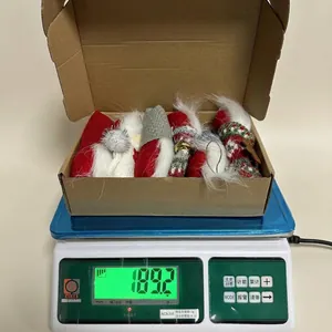Weight display of 6pcs Christmas gnome plush pendants set in a corrugated cardboard box