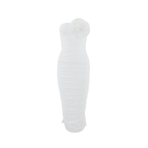 Detail showing the white strapless dress with ruched fabric and large 3D flower accent