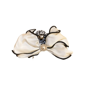 Elegant white satin bow hair claw with pearl detail and black scalloped edges