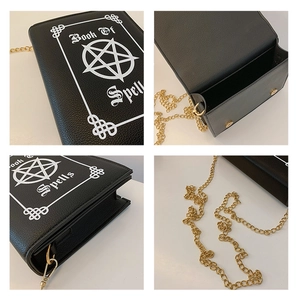 Close-up of gothic book-shaped crossbody bag featuring Book Of Spells print and chain